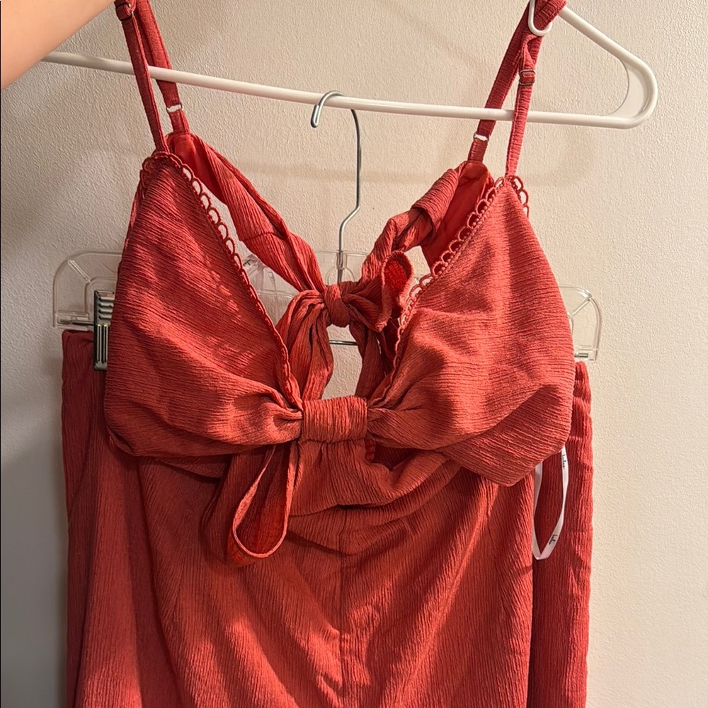 Chic Red Jumpsuit with Bow Detail